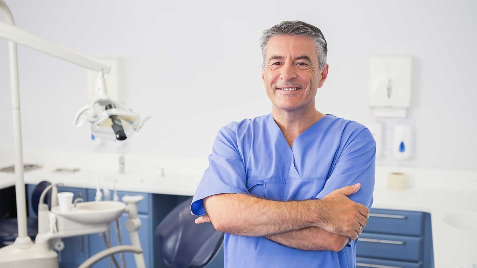 Dentist stood in treatment room